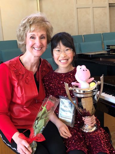 Aurora and her good luck charm with the Swedish Musical Club trophy